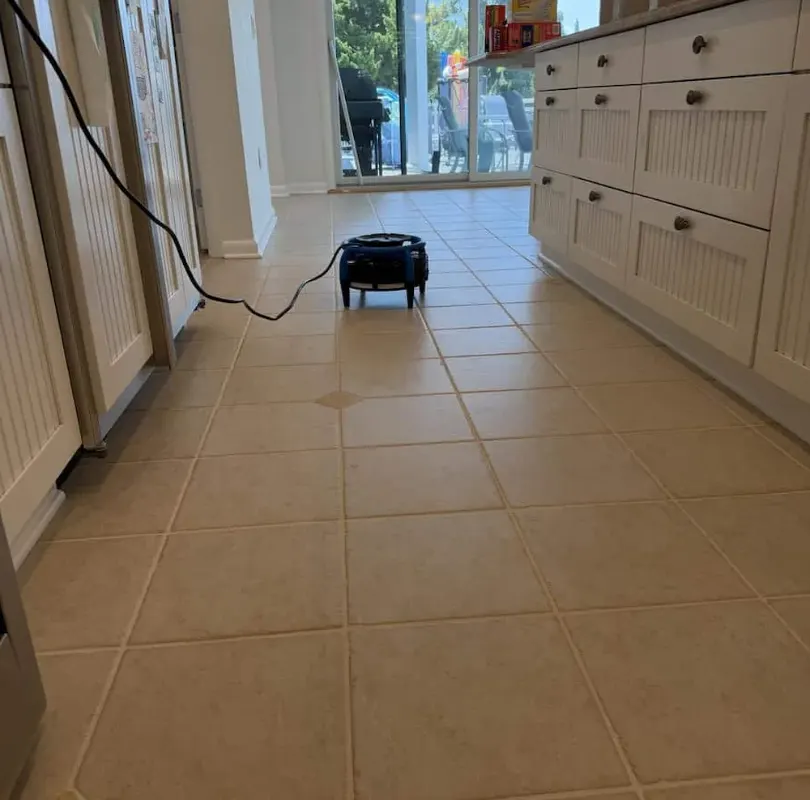 Cleaned tile kitchen floor with a drying fan