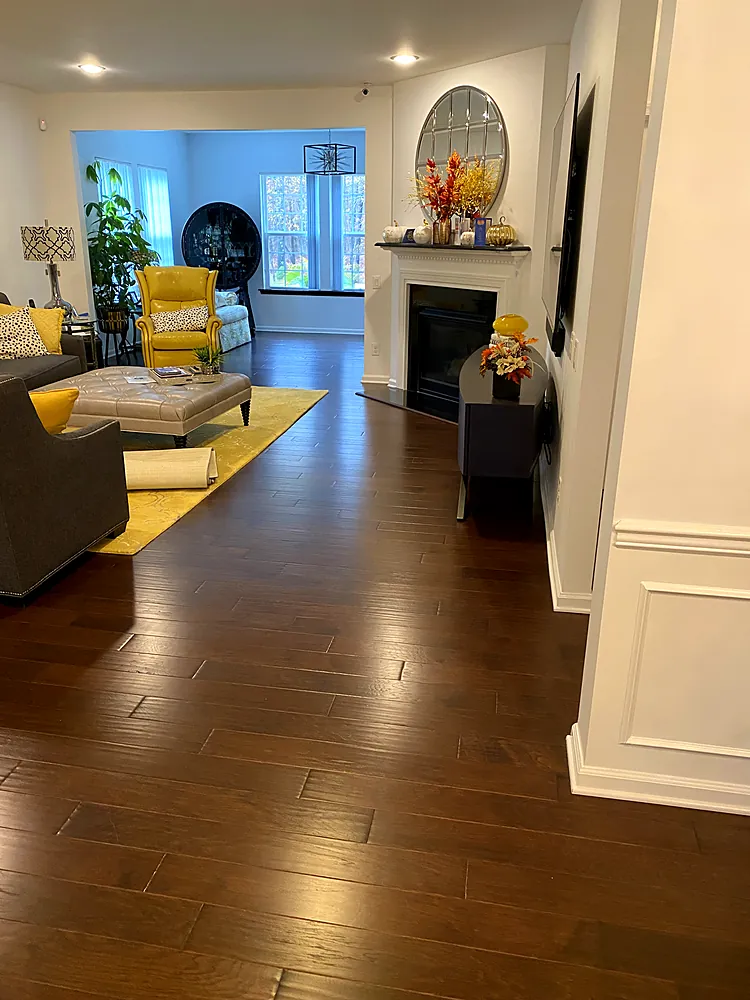 Dark hardwood family room floor after professional cleaning
