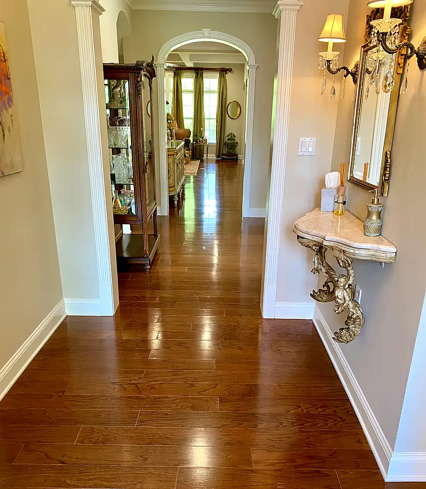 Glossy hardwood hallway after professional floor cleaning in a Monmouth County, NJ home