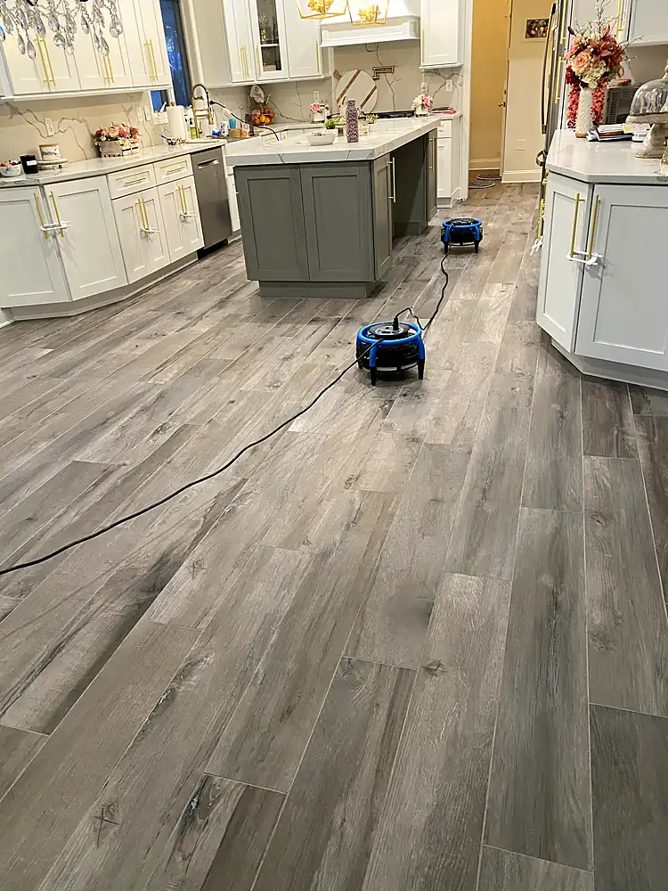 Wood-look tile kitchen floor drying with air movers after cleaning in a Monmouth County, NJ home