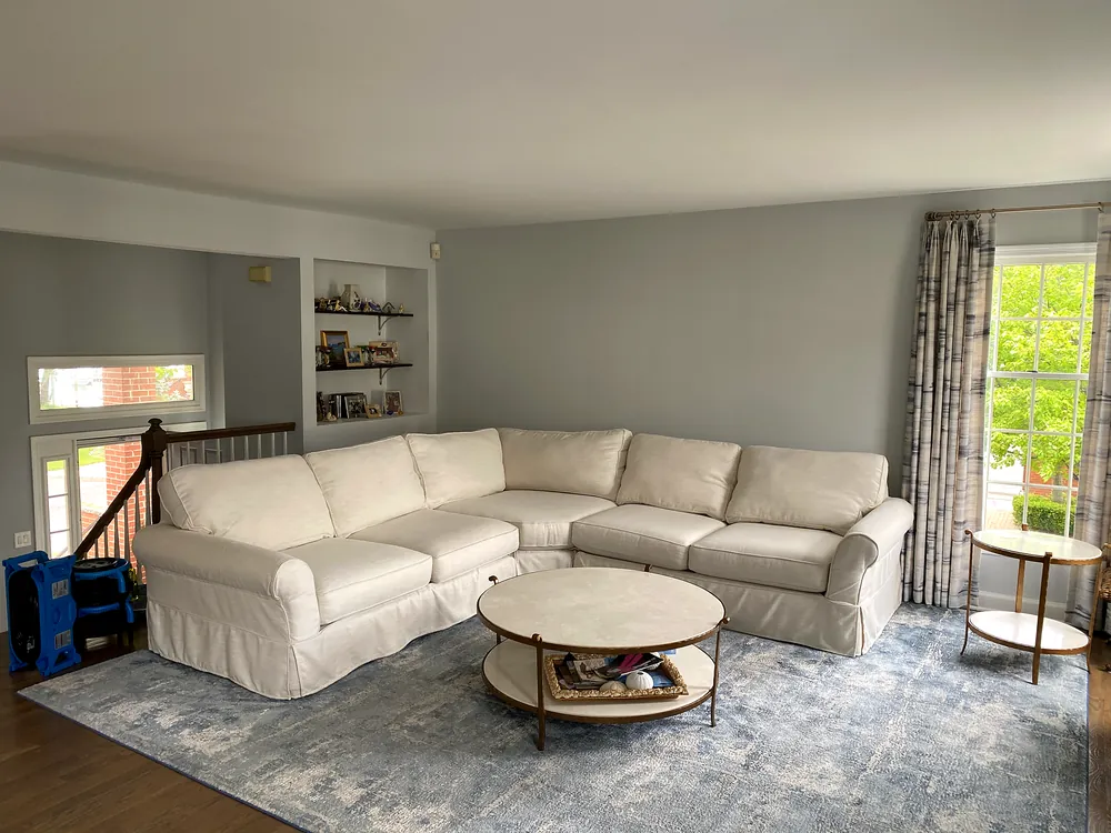 Slipcovered sectional after upholstery cleaning in a family room
